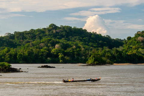 River with boat traveling to a destination 