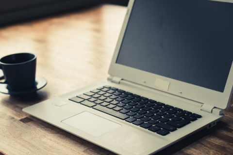 laptop on a wooden desk