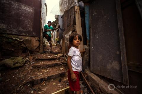 Boys stand in an alletway in a favela, or slum, in Sao Paolo, Brazil