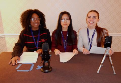 Three students with podcasting equipment