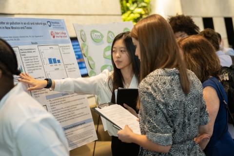 Amy Liu presenting her research poster