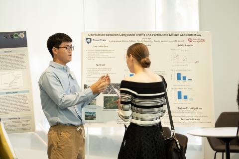 Student presenting their research poster at the National Science Fair