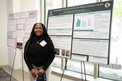 Kiyana McKnight in front of her award winning poster