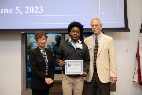 Desmond Bristow accepting his award certificate