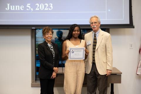 Tamauri Winn accepting her Community Impact award certificate