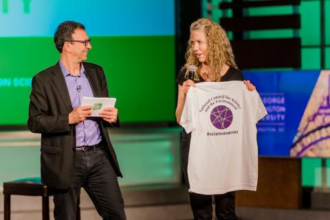 Man and woman on stage presenting