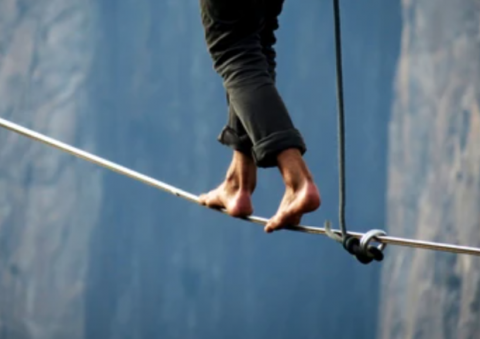 tight rope walker over canyon