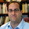 A portrait of Darren Ranco in  front of a nice bookshelf